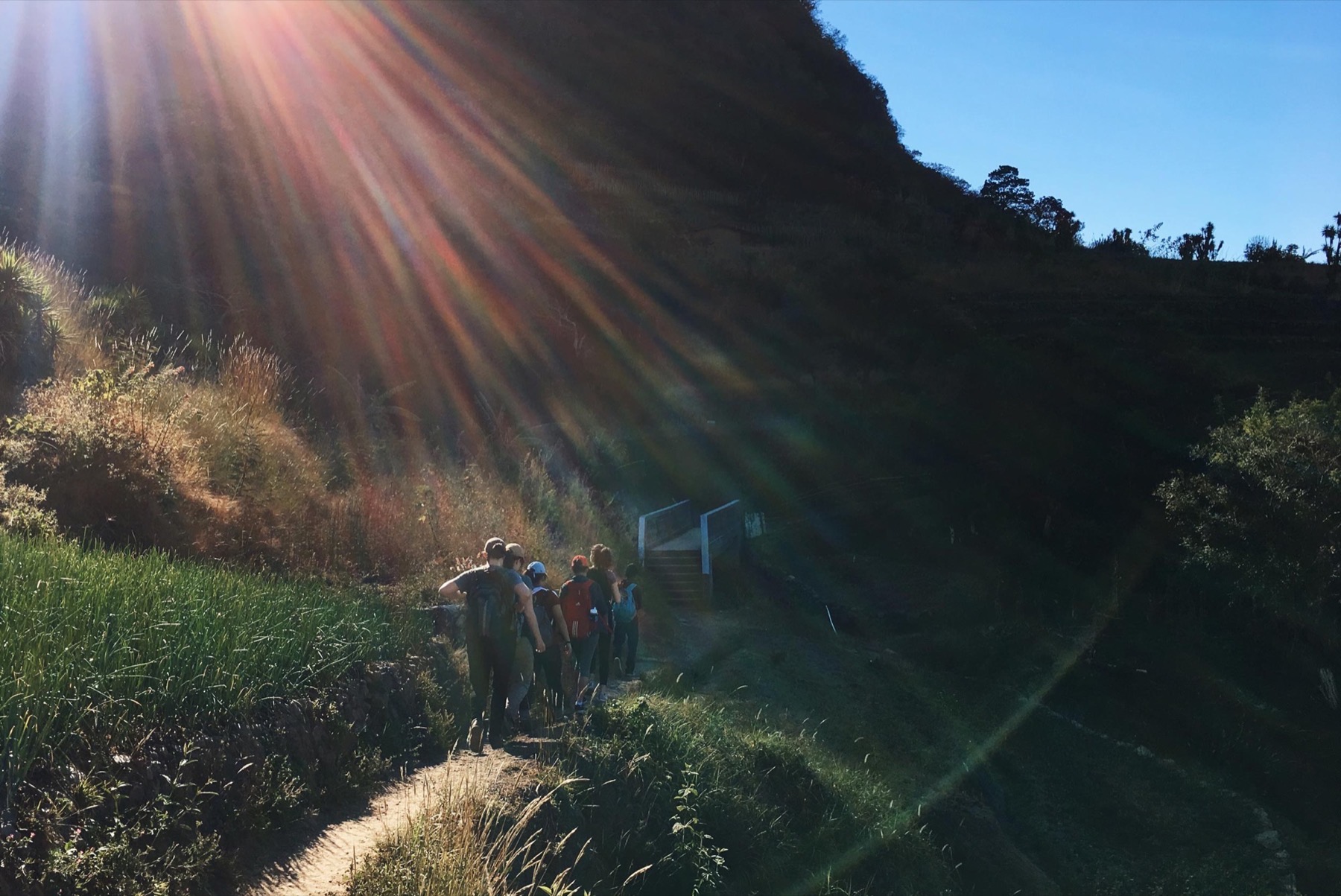 Participants hiking above the lake