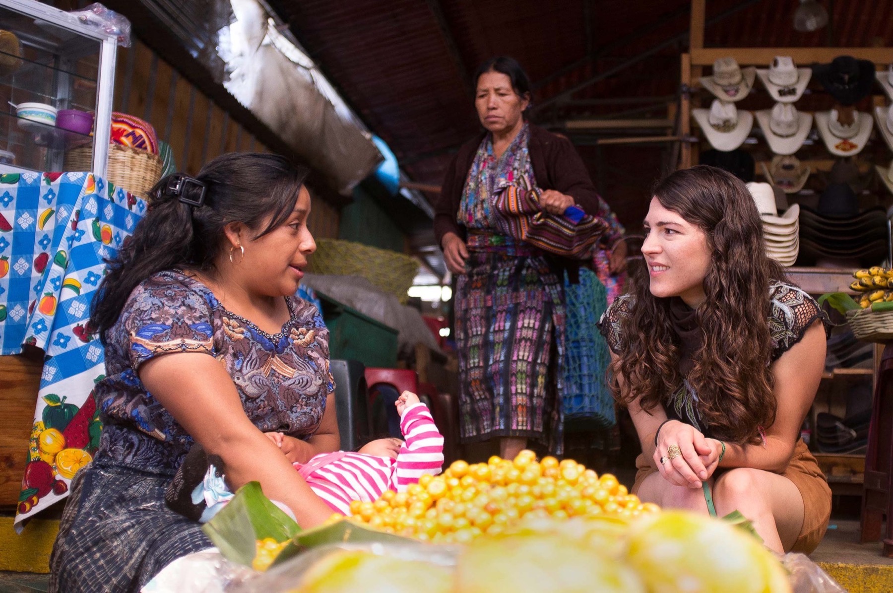 Two women talking in a village market